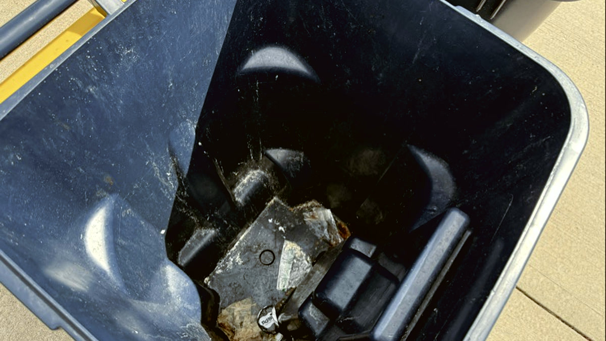 Dirty trash bin before professional cleaning — grime and bacteria buildup
