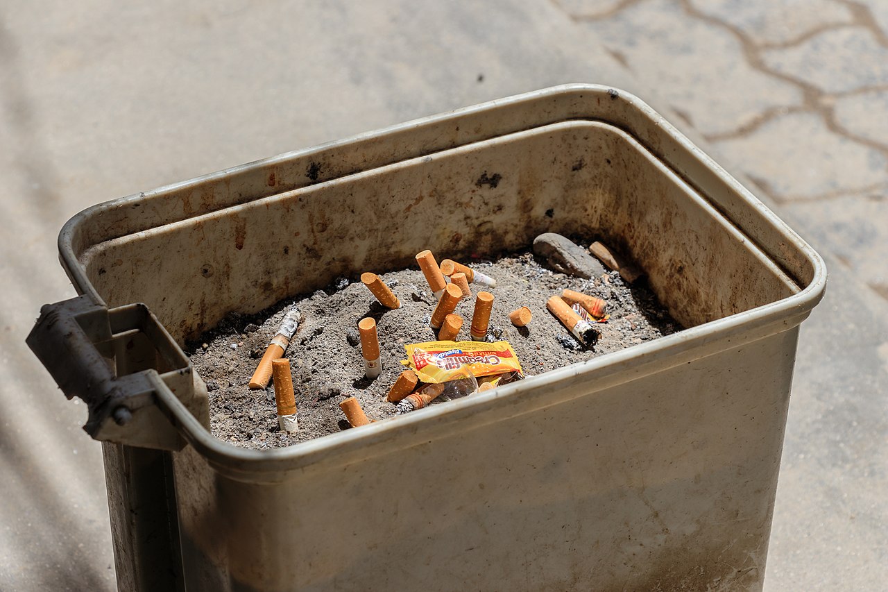 Grimy, neglected curbside bins with built-up residue coating the plastic
